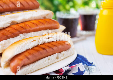 Tasty hot dogs on an outdoor table. Stock Photo