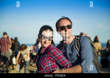 Happy young tourist couple smiling and having fun on Europe vacation trip in Barcelona, Spain. Stock Photo