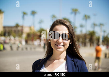 Happy young tourist woman is enjoying vacation in Barcelona, Spain. Stock Photo