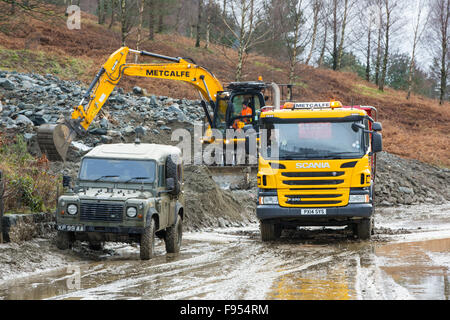 Storm Desmond created the worst floods the Lake District has ever seen, wreaking havoc on the roads. The A591, the main road through the Lake District was closed after parts of it were washed away and other parts were left under mountains of rubble washed onto thew road from the slopes of Helvellyn. The Army has been brought in to help clear the road, though it is likely to remain closed for weeks if not months while the part that was washed away is repaired. Photo taken Sunday 13th December 2015. Stock Photo