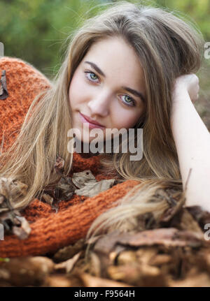 Outdoor portrait of beautiful girl in autumn forest Stock Photo