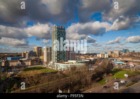The Glass Mill Leisure Centre is situated on the lowest three floors of a 27 storey apartment building in Lewisham. Panaromic view of the Leisure centre at the bottom of the apartment building with surrounding buildings. Urban scenery. Cloudy sky. Stock Photo
