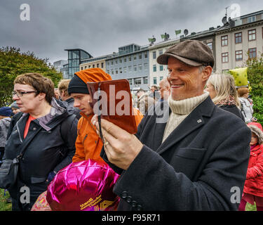Man taking pictures of people giving speeches during Iceland's Independence Day, June 17, 2015, Reykjavik, Iceland Stock Photo