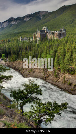Fairmont Banff Springs and Bow River Falls in snowy autumn sunny day ...