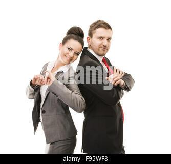 Young smiling business woman and business man isolated over white background. Crazy and funny posing in studio. Stock Photo