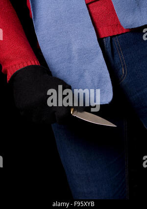 The man who holds knife in his hand ready to attack Stock Photo