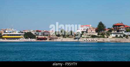 Nessebar resort town, Bulgaria. Coastal landscape with beach and old buildings on sea coast Stock Photo