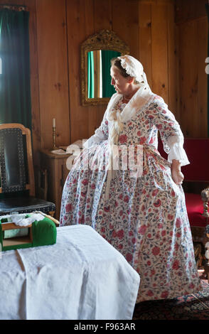 In this reenactment of daily life at Fortress of Louisbourg in the 18th Century, a woman is portaying the wife of Captain De Stock Photo