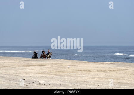 Three Horseback Riders - Assateague Island National Seashore Stock Photo