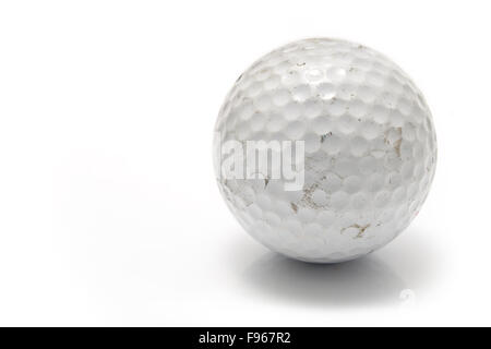 Old used golf ball isolated on white Stock Photo
