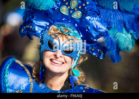 a woman in a flamboyant carnival outfit at Alzheimer's Society Memory Walk at Liverpool Festival Gardens. Stock Photo