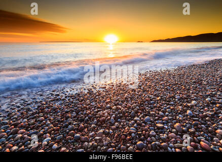 Pebble beach at sunset on Lake Superior at Agawa Bay, Lake Superior Provincial Park, Ontario, Canada Stock Photo