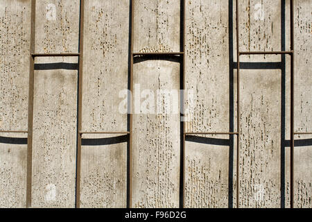 Iron bars in front off pealing wall as background Stock Photo