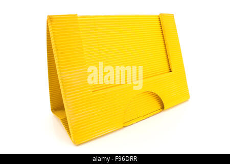 Yellow cardboard paper holder isolated on white Stock Photo