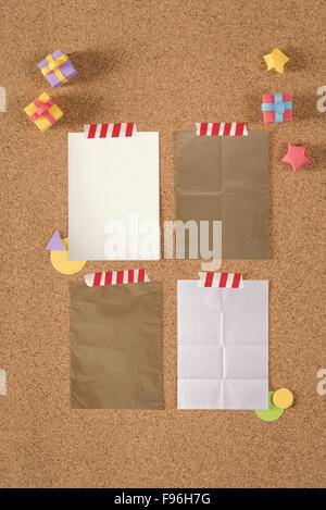 Paper texture notes template on cork notice board background with colorful cute handmade elements, including clipping path. Stock Photo