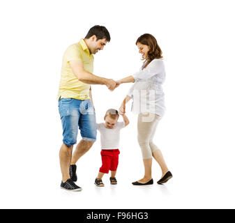 Portrait of the happy family with little boy and pregnant mother playing, isolated on white background Stock Photo