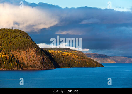 Section of fjord that rises alongside the Saguenay River as seen from the burrough of La Baie in Quebec, Canada Stock Photo