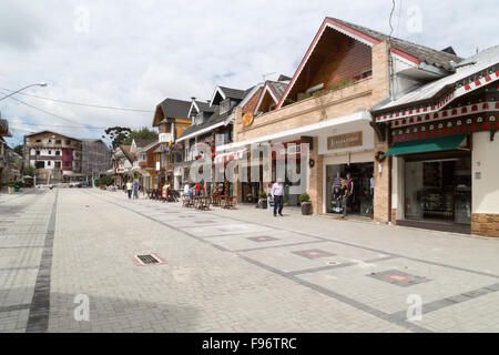 Pedestrian street scene, Swiss and German style European architecture, restaurants and stores at Capivari, Campos do Jordao, Sao Paulo, Brazil Stock Photo