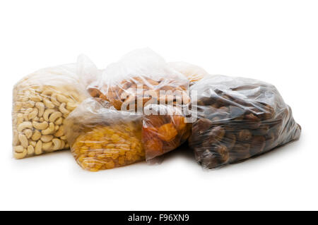 Various dry fruits in the bags on white Stock Photo