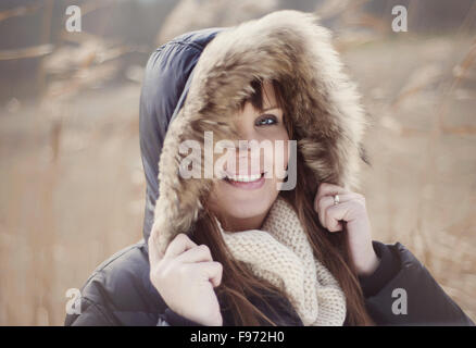 Portrait of woman with hood on in autumn country Stock Photo