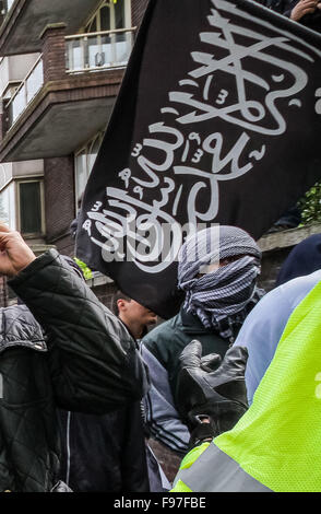 London, UK. 14th December, 2015. File Images from 18th April 2014: British-based Islamist Nadir Syed found guilty of murder plot. Seen here (in headscarf) during a clash with police and far right protest groups outside Regents Park Mosque in London Credit:  Guy Corbishley/Alamy Live News Stock Photo