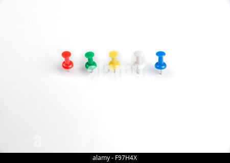 4 pins in a row on a white background Stock Photo