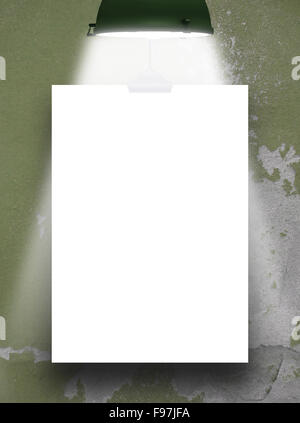 One hanged paper sheet frame with dark green retro lamp on cracked and scratched plastered wall background Stock Photo