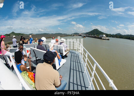 PANAMA CANAL, Panama--On Miraflores Lake on the Panama Canal. Opened in 1914, the Panama Canal is a crucial shipping lane between the Atlantic and Pacific Oceans that mean that ships don't have to go around the bottom of South America or over the top of Canada. The Canal was originally built and owned by the United States but was handed back to Panama in 1999. Stock Photo