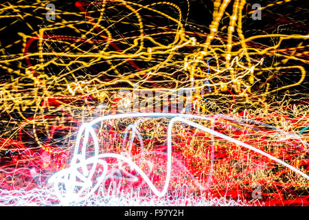 Multicolored light streaks from Neon, Sodium, and LED lights from an Urban street in a modern city. Stock Photo