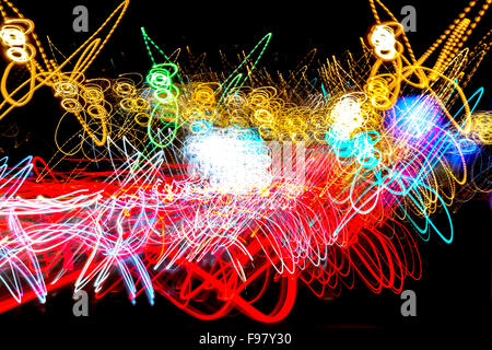Red Yellow Blue and Green Abstract  of Neon Sodium lights on a black background - strong lights combined with circular flashing Stock Photo
