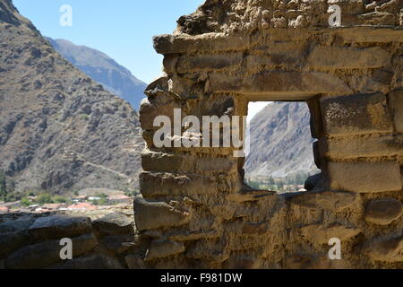View through the window at the Inca ruins of Ollantaytambo in the Sacred Valley of Peru. Stock Photo