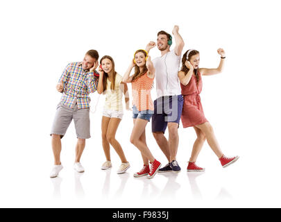 Group of young people listening to the music, isolated on white background. Stock Photo