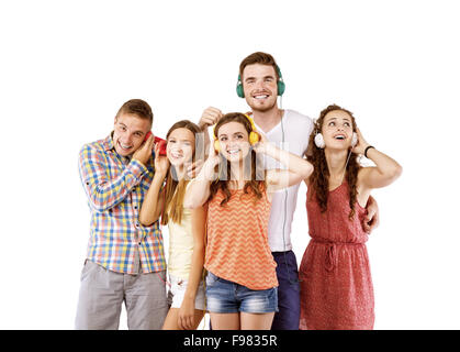 Group of young people listening to the music, isolated on white background. Stock Photo