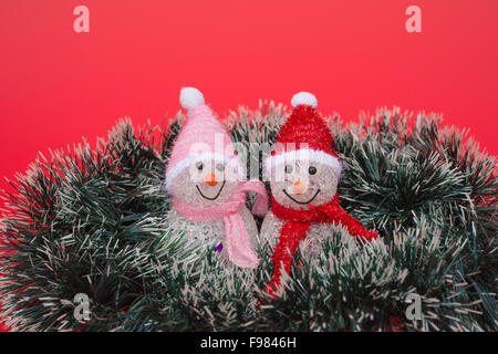 two smiling toy christmas snowman Stock Photo
