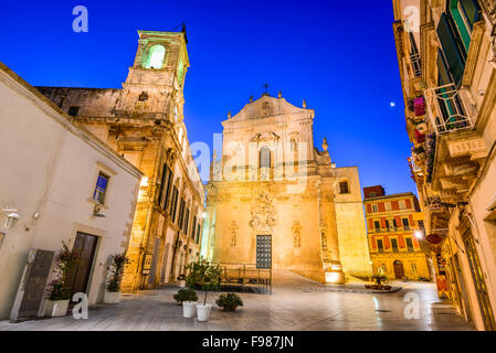 Martina Franca, Puglia in Italy. Piazza Plebiscito and Basilica di San Martino at twilight. Stock Photo