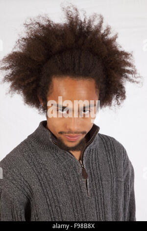 Black man looking thoughtfully at the camera Stock Photo