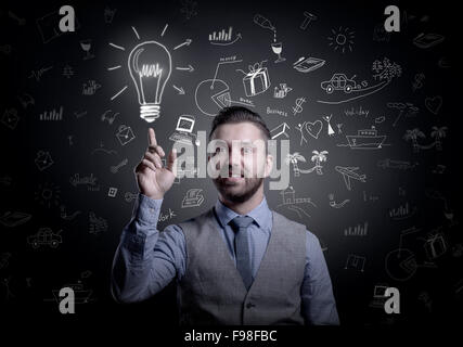 Hipster businessman with idea, light bulb above his head, isolated on black background Stock Photo