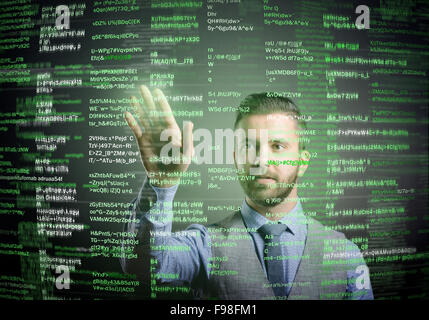 Hipster businessman working on digital virtual screen and business strategy as concept, isolated on black background Stock Photo