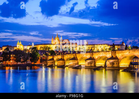 Prague, Czech Republic. Charles Bridge and Hradcany (Prague Castle) with St. Vitus Cathedral and St. George church evening dusk,