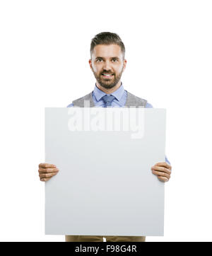 Studio shot of modern hipster businessman holding blank advertisement, isolated on white background Stock Photo