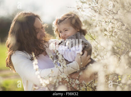 Portrait of little girl with her pregnant mother Stock Photo