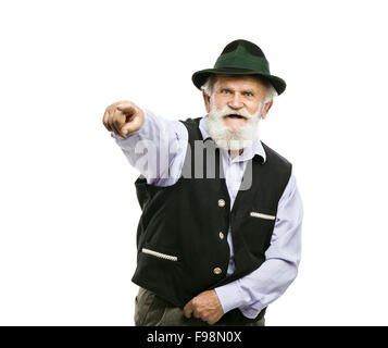 Portrait of old bearded bavarian man in traditional hat pointing upwards isolated on white background Stock Photo