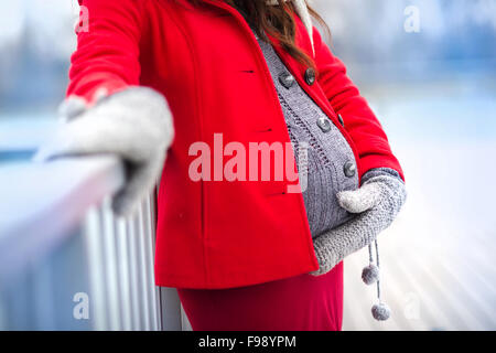 Detail of unrecognizable pregnant woman's belly in winter Stock Photo