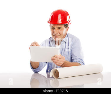 Portrait Of Happy Senior Engineer Holding Digital Tablet And Plans Isolated Over White Background Stock Photo