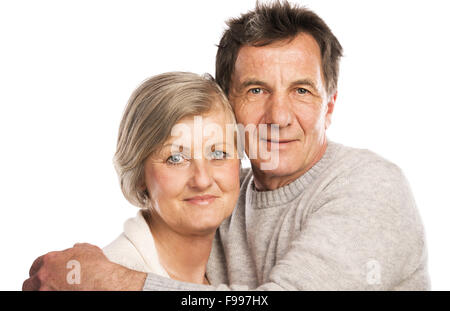 Studio portrait of happy senior couple in love. Isolated over white background. Stock Photo