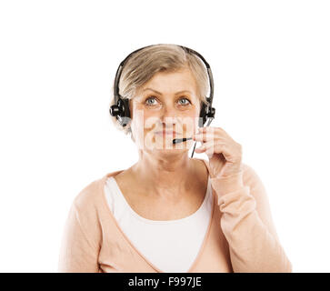 Happy senior woman wearing headset, isolated on white background Stock Photo