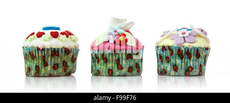 Three tasty cupcakes isolated on white background Stock Photo