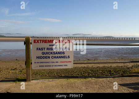 'Extreme Danger' sign warning of tides, quicksands, and channels in the Kent estuary. Arnside, Cumbria, England, June. Stock Photo