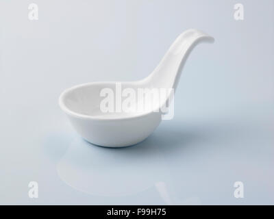 white saucer disgn like a spoon Stock Photo