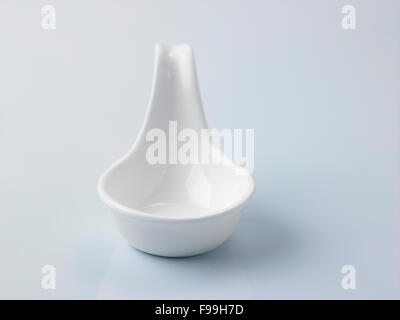 white saucer disgn like a spoon Stock Photo